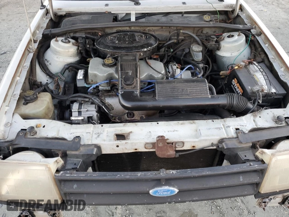 1988 Ford Escort z VIN 1FAPP959XJW370611, wystawiony jako Copart lot #86715994 z przebiegiem 3424 mil mil oraz Tytuł czysty. Historia ofert i sprzedaży dostępna na DreamBid. Obrazek 11.