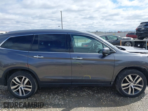 2017 Honda Pilot Touring with VIN 5FNYF6H92HB036406, listed as a IAAI auction lot 41949223 with 147,462 mi miles. Bid and sale history available at carsss.com. Image 13.