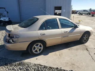1999 Ford Escort SE with VIN 1FAFP13P2XW137703, listed as a Copart auction lot 42448555 with 168,910 mi miles and Salvage Title. Bid and sale history available at carsss.com. Image 3.