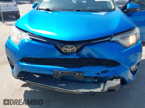 2018 Toyota RAV4 XLE with VIN JTMWFREV2JJ168557, listed as a IAAI auction lot 41994837 with 107,636 mi miles. Bid and sale history available at carsss.com. Image 6.