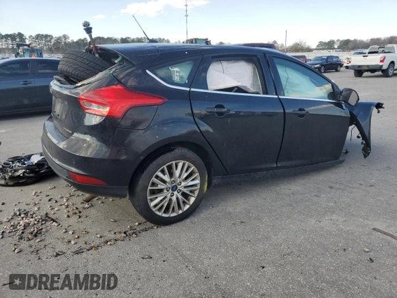 2017 Ford Focus Titanium z VIN 1FADP3N23HL291408, wystawiony jako Copart lot #83876124 z przebiegiem Nie podano mil oraz Szkoda całkowita • Salvage title. Historia ofert i sprzedaży dostępna na DreamBid. Obrazek 3.