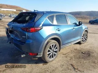 2018 Mazda CX-5 Touring z VIN JM3KFBCM2J0461954, wystawiony jako IAAI lot #41655865 z przebiegiem 129 333 mil mil oraz . Historia ofert i sprzedaży dostępna na DreamBid. Obrazek 4.
