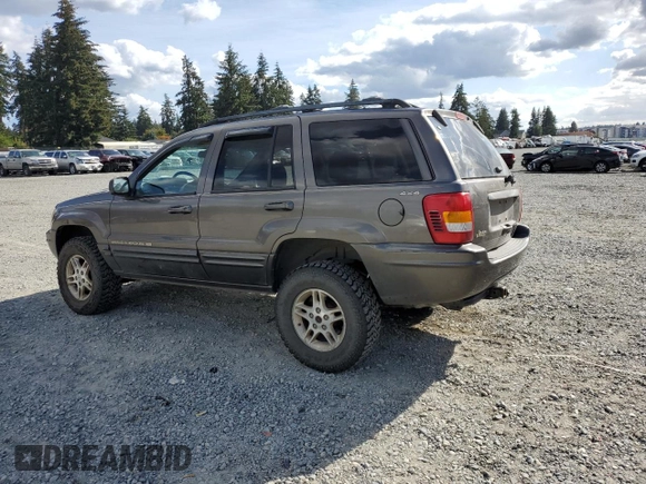 1999 Jeep Grand Cherokee Limited with VIN 1J4GW68S2XC677334, listed as a Copart auction lot 74152054 with 242,220 mi miles and Salvage Title. Bid and sale history available at carsss.com. Image 2.
