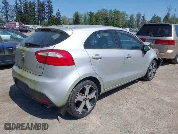 2014 Kia Rio SX with VIN KNADN5A31E6353714, listed as a IAAI auction lot 42127657 with 117,544 mi miles. Bid and sale history available at carsss.com. Image 4.