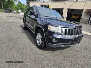 2011 Jeep Grand Cherokee Laredo with VIN 1J4RR4GG6B0523168, listed as a Copart auction lot 63490385 with 172,307 mi miles and Clean title. Bid and sale history available at DreamBid. Image 1.