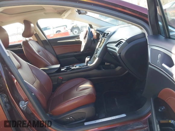 2016 Ford Fusion Titanium with VIN 3FA6P0K90GR244717, listed as a IAAI auction lot 41395806 with 151,853 mi miles. Bid and sale history available at carsss.com. Image 5.