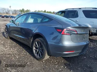 2023 Tesla Model 3 with VIN 5YJ3E1EAXPF666252, listed as a IAAI auction lot 42009929 with 27,328 mi miles and . Bid and sale history available at DreamBid. Image 3.