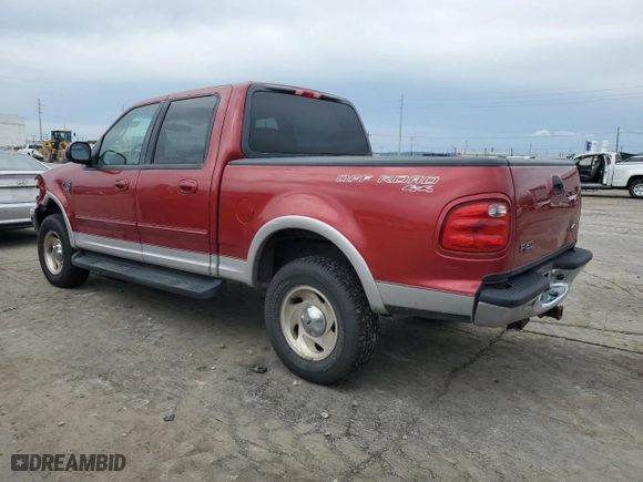 2001 Ford F-150 SuperCrew XLT with VIN 1FTRW08L81KA41003, listed as a Copart auction lot 72388534 with 319,211 mi miles and Salvage Title. Bid and sale history available at carsss.com. Image 2.