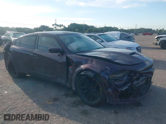 2021 Dodge Charger Scat Pack Widebody with VIN 2C3CDXGJXMH559036, listed as a IAAI auction lot 41895328 with 55,017 mi miles and . Bid and sale history available at DreamBid. Image 1.