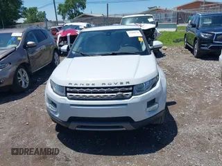 2015 Land Rover Range Rover Evoque Pure Premium z VIN SALVR2BG2FH075464, wystawiony jako IAAI lot #42268278 z przebiegiem 135 426 mil mil oraz . Historia ofert i sprzedaży dostępna na DreamBid. Obrazek 13.