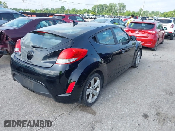 2013 Hyundai Veloster w/Gray Int with VIN KMHTC6ADXDU086856, listed as a IAAI auction lot 42503453 with 187,657 mi miles and . Bid and sale history available at DreamBid. Image 4.