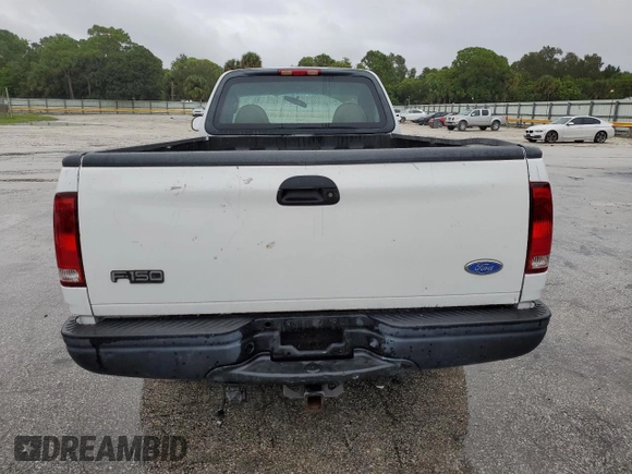 2002 Ford F-150 XL with VIN 1FTRF17W32NB86385, listed as a Copart auction lot 73276754 with 100,817 mi miles and Salvage Title. Bid and sale history available at carsss.com. Image 6.