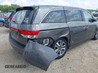 2014 Honda Odyssey Touring with VIN 5FNRL5H99EB138952, listed as a IAAI auction lot 42538833 with 146,959 mi miles and . Bid and sale history available at DreamBid. Image 6.