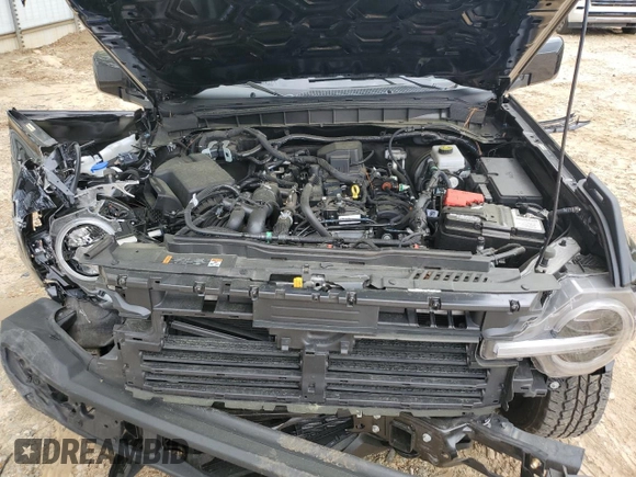 2023 Ford Bronco z VIN 1FMDE5BH0PLB30495, wystawiony jako Copart lot #51380065 z przebiegiem 18 156 mil mil oraz Szkoda całkowita • Salvage title. Historia ofert i sprzedaży dostępna na DreamBid. Obrazek 14.