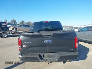 2015 Ford F-150 XLT with VIN 1FTEW1E86FFC00959, listed as a IAAI auction lot 41581711 with 130,298 mi miles. Bid and sale history available at carsss.com. Image 16.