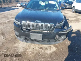 2019 Jeep Cherokee Latitude Plus with VIN 1C4PJMLB2KD261304, listed as a IAAI auction lot 41877500 with 76,442 mi miles and . Bid and sale history available at DreamBid. Image 12.