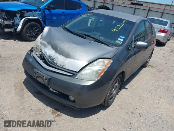 2007 Toyota Prius z VIN JTDKB20U073245052, wystawiony jako IAAI lot #42368508 z przebiegiem 116 953 mil mil oraz . Historia ofert i sprzedaży dostępna na DreamBid. Obrazek 2.