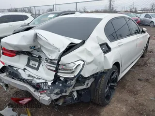 2016 BMW 7 Series 740i with VIN WBA7E2C50GG714647, listed as a IAAI auction lot 41745442 with 134,399 mi miles and . Bid and sale history available at carsss.com. Image 4.