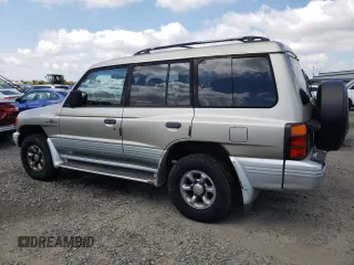 1998 Mitsubishi Montero z VIN JA4MR51RXWJ006418, wystawiony jako Copart lot #54878275 z przebiegiem 225 110 mil mil oraz Szkoda całkowita • Salvage title. Historia ofert i sprzedaży dostępna na DreamBid. Obrazek 2.