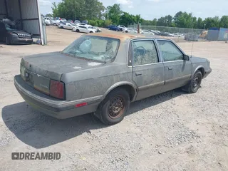 1989 Oldsmobile Cutlass Ciera with VIN 2G3AJ51NXK2439345, listed as a IAAI auction lot 42128301 with 241,434 mi miles and . Bid and sale history available at DreamBid. Image 4.