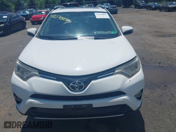 2016 Toyota RAV4 XLE with VIN JTMRFREV0GJ073114, listed as a IAAI auction lot 42548094 with 119,431 mi miles and . Bid and sale history available at DreamBid. Image 12.
