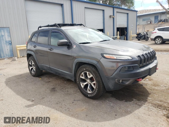 2014 Jeep Cherokee Trailhawk with VIN 1C4PJMBS6EW140981, listed as a Copart auction lot 58260325 with 97,036 mi miles and Salvage title. Bid and sale history available at DreamBid. Image 4.