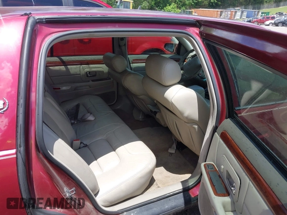 1999 Cadillac DeVille z VIN 1G6KD54Y4XU718666, wystawiony jako IAAI lot #42327746 z przebiegiem 84 226 mil mil oraz . Historia ofert i sprzedaży dostępna na DreamBid. Obrazek 8.