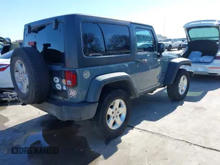 2014 Jeep Wrangler Sport with VIN 1C4AJWAGXEL177449, listed as a IAAI auction lot 41741519 with 117,056 mi miles and . Bid and sale history available at carsss.com. Image 4.