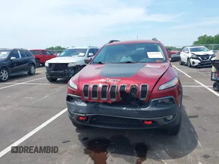 2014 Jeep Cherokee Trailhawk with VIN 1C4PJMBS7EW162357, listed as a IAAI auction lot 42601903 with 104,768 mi miles and . Bid and sale history available at DreamBid. Image 12.