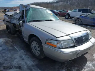 2005 Mercury Grand Marquis GS with VIN 2MEFM74W25X618546, listed as a IAAI auction lot 41623073 with 129,356 mi miles. Bid and sale history available at carsss.com. Image 1.
