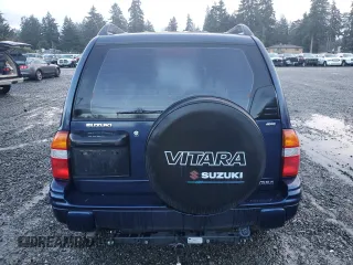 2001 Suzuki Vitara JX z VIN 2S3TD52V916109753, wystawiony jako Copart lot #41543965 z przebiegiem 102 720 mil mil oraz Szkody całkowita. Historia ofert i sprzedaży dostępna na DreamBid. Obrazek 6.