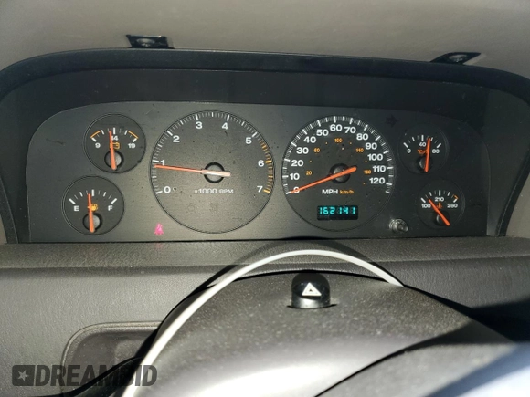 2001 Jeep Grand Cherokee Laredo z VIN 1J4GW48S11C609344, wystawiony jako Copart lot #59258245 z przebiegiem 162 141 mil mil oraz Szkoda całkowita • Salvage title. Historia ofert i sprzedaży dostępna na DreamBid. Obrazek 9.