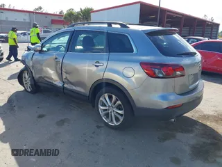 2015 Mazda CX-9 Sport with VIN JM3TB2BA1F0467162, listed as a IAAI auction lot 41565602 with 127,957 mi miles and . Bid and sale history available at carsss.com. Image 3.