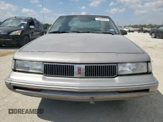1996 Oldsmobile Cutlass Ciera 1SA VX5 z VIN 1G3AJ55M2T6354131, wystawiony jako Copart lot #74458314 z przebiegiem 55 998 mil mil oraz Szkody całkowita. Historia ofert i sprzedaży dostępna na DreamBid. Obrazek 5.