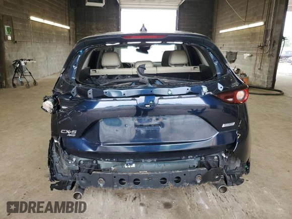 2018 Mazda CX-5 Touring z VIN JM3KFBCM3J0464815, wystawiony jako Copart lot #58794685 z przebiegiem Nie podano mil oraz Szkoda całkowita • Salvage title. Historia ofert i sprzedaży dostępna na DreamBid. Obrazek 6.