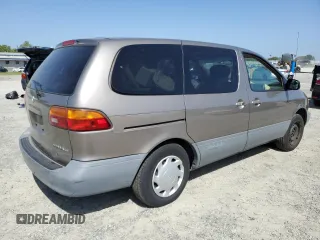 1999 Toyota Sienna CE z VIN 4T3ZF19C4XU163765, wystawiony jako Copart lot #54405805 z przebiegiem Nie podano mil oraz Szkody całkowita. Historia ofert i sprzedaży dostępna na DreamBid. Obrazek 3.