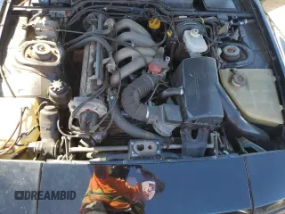 1986 Porsche 944 z VIN WP0AA0942GN460359, wystawiony jako Copart lot #56519965 z przebiegiem 95 915 mil mil oraz Szkoda całkowita • Salvage title. Historia ofert i sprzedaży dostępna na DreamBid. Obrazek 11.