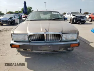 1994 Jaguar XJ с VIN SAJKX174XRC692378, выставлен на аукционе Copart как лот 65275795 с пробегом 80 748 миль миль и Чистый • Clean title. История ставок и продаж доступна на DreamBid. Изображение 5.