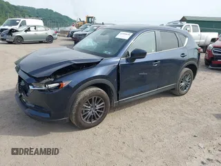 2021 Mazda CX-5 Touring z VIN JM3KFBCMXM0389857, wystawiony jako IAAI lot #42309650 z przebiegiem 49 938 mil mil oraz . Historia ofert i sprzedaży dostępna na DreamBid. Obrazek 2.