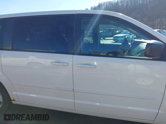 2013 Dodge Grand Caravan SE with VIN 2C4RDGBG0DR760598, listed as a IAAI auction lot 41590428 with 182,847 mi miles and . Bid and sale history available at DreamBid. Image 13.