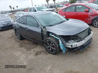 2018 Honda Civic Si z VIN 2HGFC1E59JH710458, wystawiony jako IAAI lot #42147386 z przebiegiem 89 650 mil mil oraz . Historia ofert i sprzedaży dostępna na DreamBid. Obrazek 1.