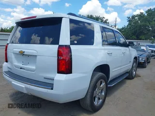 2020 Chevrolet Tahoe LTZ with VIN 1GNSCCKCXLR215899, listed as a IAAI auction lot 40128171 with 109,541 mi miles and . Bid and sale history available at DreamBid. Image 4.