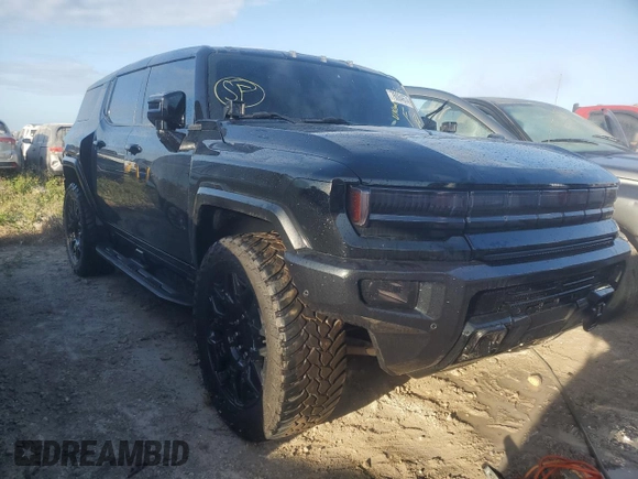 2024 GMC Hummer EV 3X z VIN 1GKB0RDC4RU103837, wystawiony jako Copart lot #76064674 z przebiegiem Nie podano mil oraz Nie do naprawy. Historia ofert i sprzedaży dostępna na DreamBid. Obrazek 4.