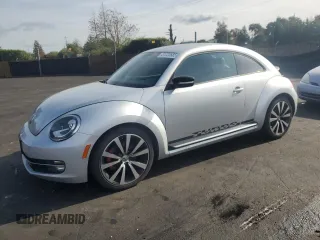 2012 Volkswagen Beetle 2.0T Turbo w/Sun/Snd/Nav PZEV with VIN 3VWVA7AT2CM660169, listed as a Copart auction lot 51722685 with 94,841 mi miles and Clean Title. Bid and sale history available at carsss.com. Image 1.