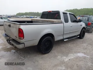 2003 Ford F-150 XL with VIN 1FTRX17253NA74389, listed as a IAAI auction lot 42072045 with 166,572 mi miles. Bid and sale history available at carsss.com. Image 4.