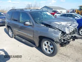 2005 GMC Envoy SLE with VIN 1GKDT13S852362380, listed as a IAAI auction lot 42031727 with 76,711 mi miles. Bid and sale history available at carsss.com. Image 6.