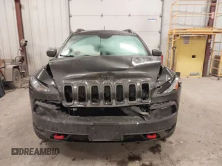 2014 Jeep Cherokee Trailhawk with VIN 1C4PJMBS2EW231813, listed as a IAAI auction lot 41664287 with 128,893 mi miles. Bid and sale history available at carsss.com. Image 12.
