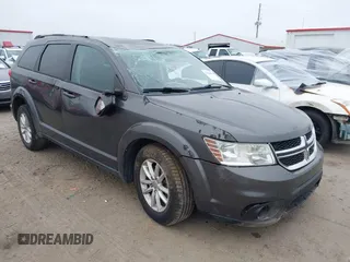 2017 Dodge Journey SXT z VIN 3C4PDCBG5HT573084, wystawiony jako IAAI lot #41524049 z przebiegiem 137 235 mil mil oraz . Historia ofert i sprzedaży dostępna na DreamBid. Obrazek 1.