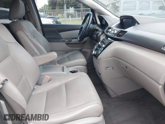 2013 Honda Odyssey Touring with VIN 5FNRL5H95DB086041, listed as a IAAI auction lot 42477974 with 213,343 mi miles and . Bid and sale history available at DreamBid. Image 5.