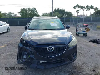 2014 Mazda CX-5 Touring with VIN JM3KE2CYXE0384987, listed as a IAAI auction lot 42052196 with 151,765 mi miles. Bid and sale history available at carsss.com. Image 12.